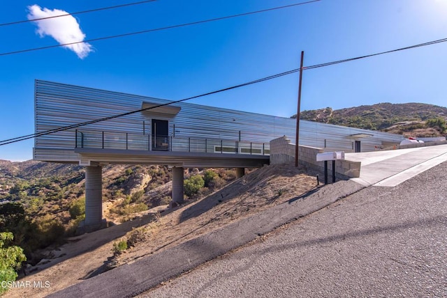 exterior space featuring a mountain view