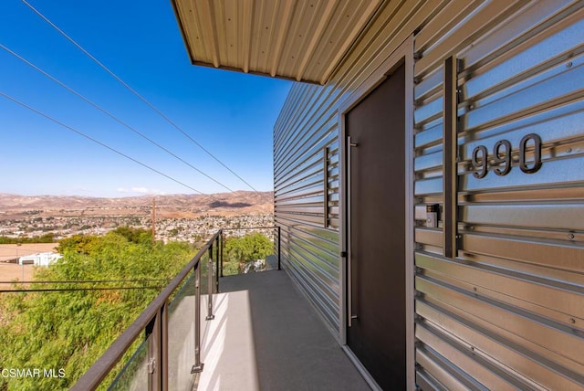 balcony featuring a mountain view