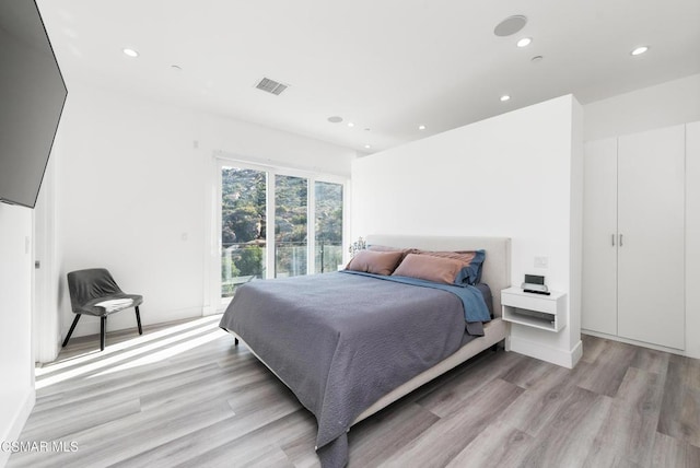 bedroom with light wood-type flooring