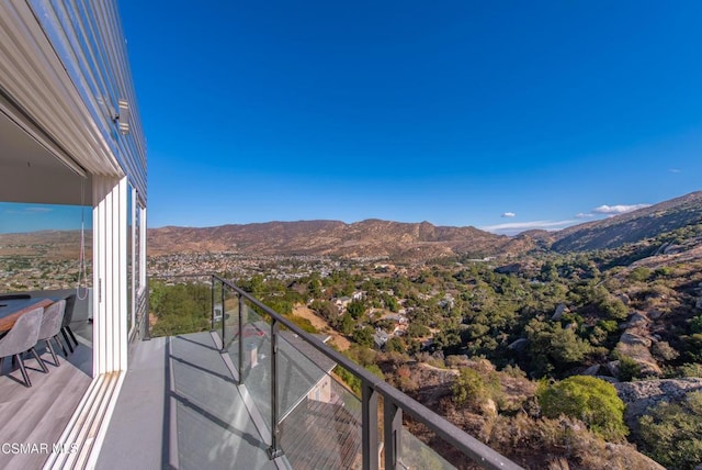 balcony featuring a mountain view