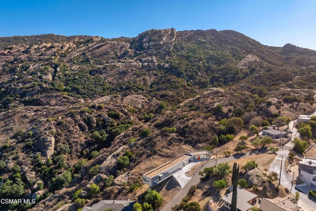 drone / aerial view featuring a mountain view