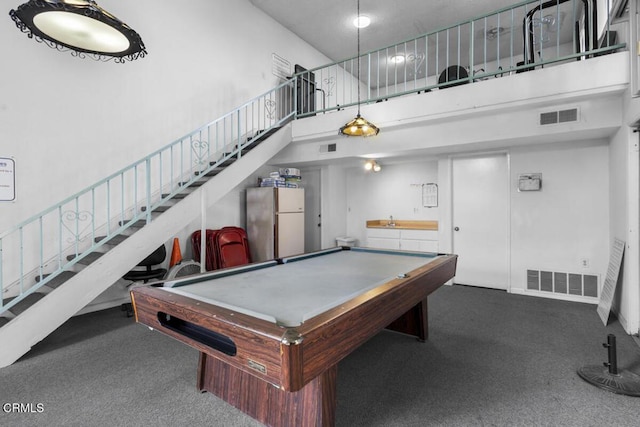 playroom featuring billiards, a towering ceiling, and visible vents