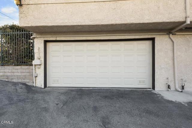 garage featuring driveway