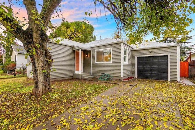 single story home with a garage