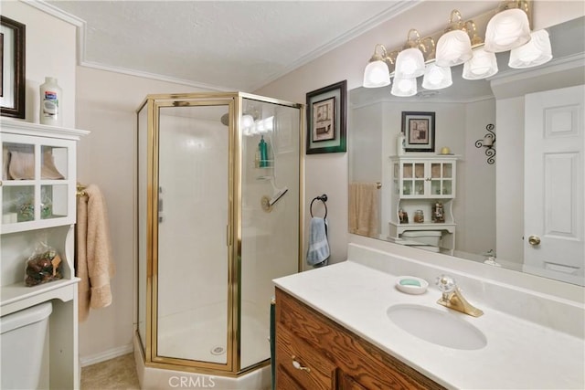 bathroom with a shower with door, crown molding, vanity, and toilet