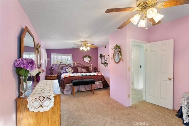 bedroom featuring ceiling fan and light colored carpet