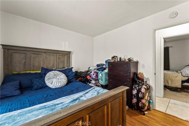 bedroom with hardwood / wood-style floors