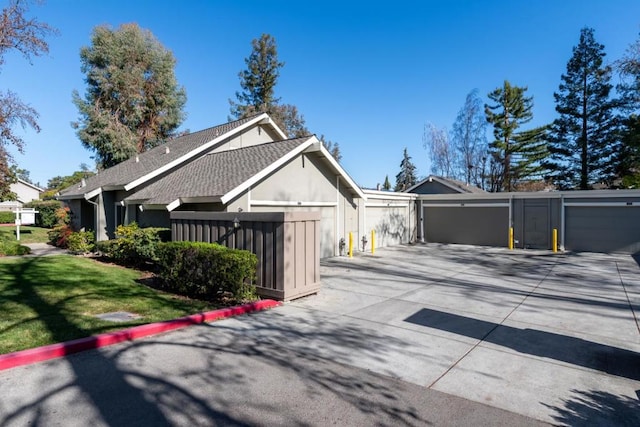 view of side of home featuring a garage