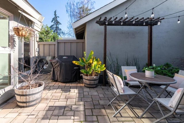 view of patio / terrace featuring a pergola and a grill