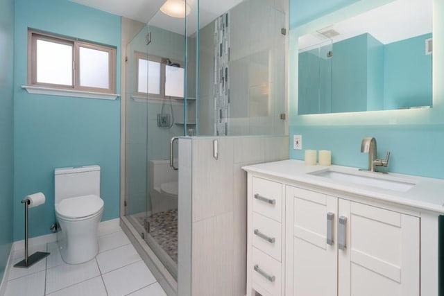 bathroom featuring toilet, an enclosed shower, vanity, and tile patterned flooring