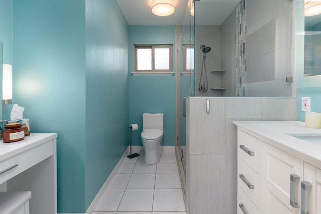 bathroom featuring tile patterned floors, an enclosed shower, vanity, and toilet