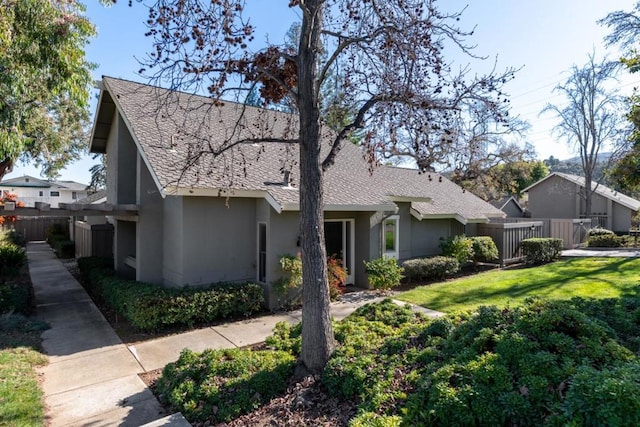 ranch-style home with a front lawn