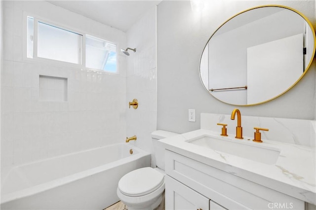 bathroom with shower / tub combination, vanity, and toilet