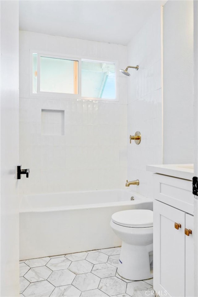 full bathroom with tub / shower combination, vanity, and toilet