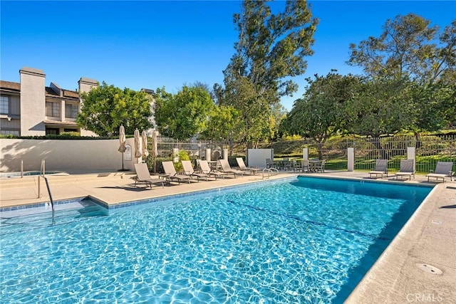 view of pool featuring a patio