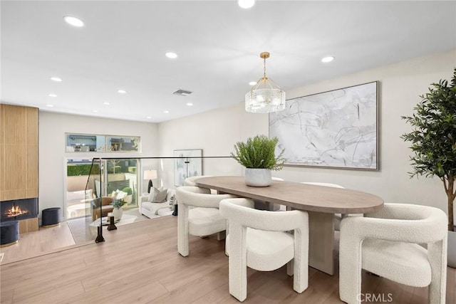 dining space with light wood-type flooring