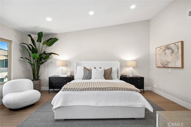 bedroom with wood-type flooring