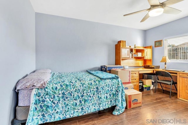 bedroom with wood-type flooring and ceiling fan