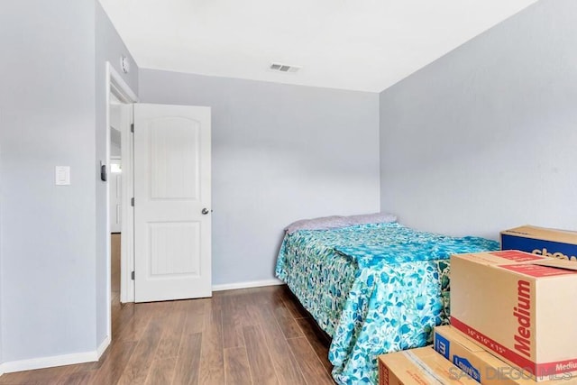 bedroom featuring dark hardwood / wood-style floors