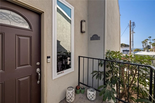 entrance to property with a balcony