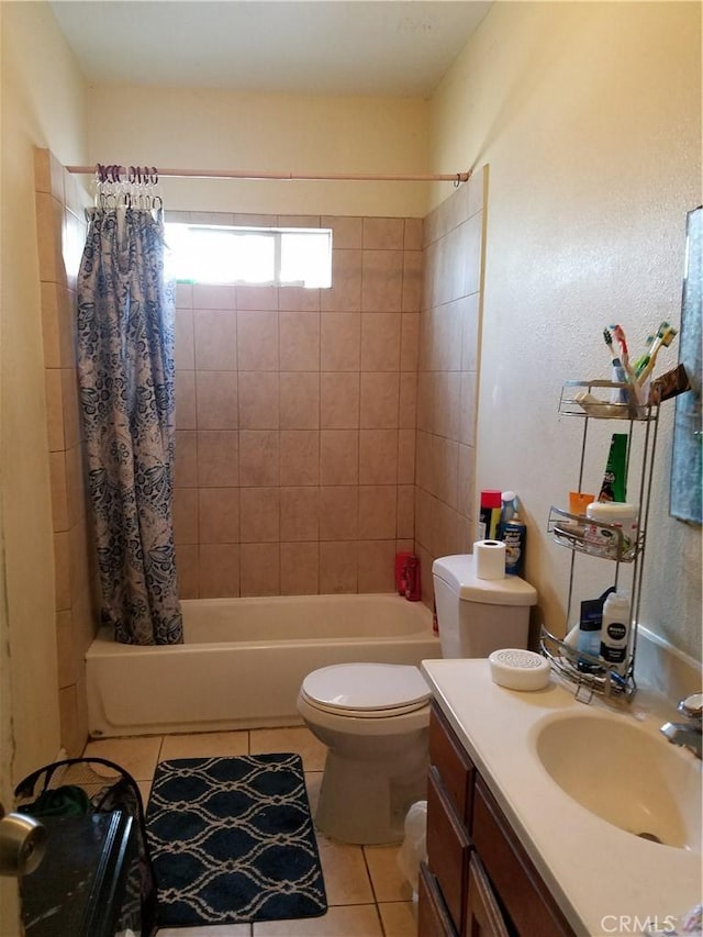 full bathroom with tile patterned flooring, shower / bath combo, vanity, and toilet