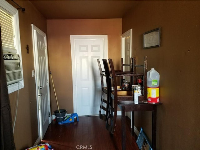 hall with dark hardwood / wood-style flooring