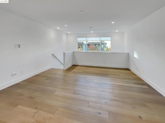 unfurnished room featuring light hardwood / wood-style flooring