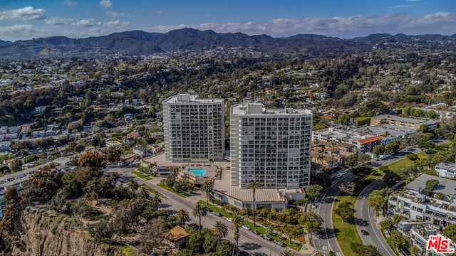 drone / aerial view featuring a mountain view