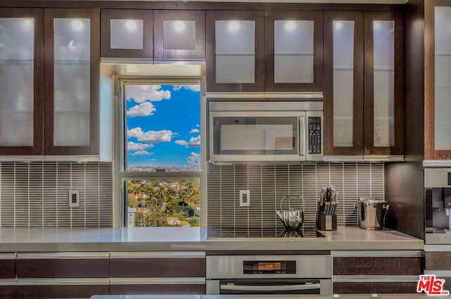 kitchen with dark brown cabinets and stainless steel appliances