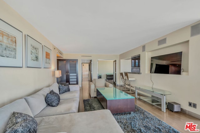 living room with light hardwood / wood-style flooring