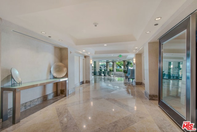 interior space with a tray ceiling