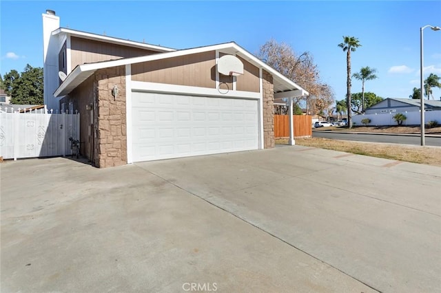 view of side of home featuring a garage