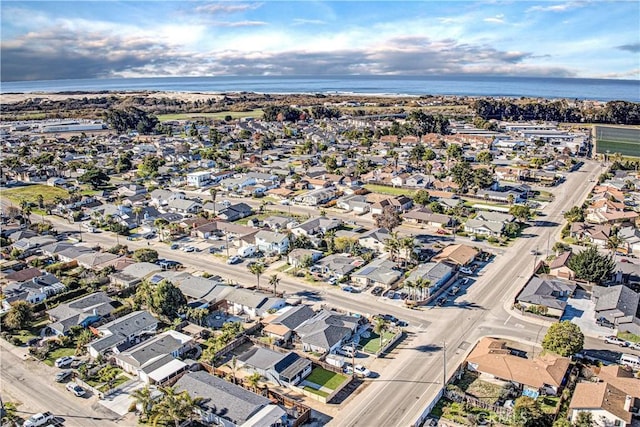 birds eye view of property with a water view and a residential view