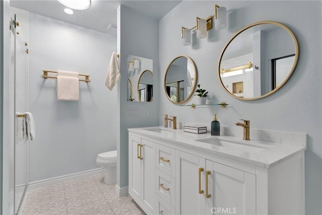 bathroom with tile patterned floors, vanity, and toilet