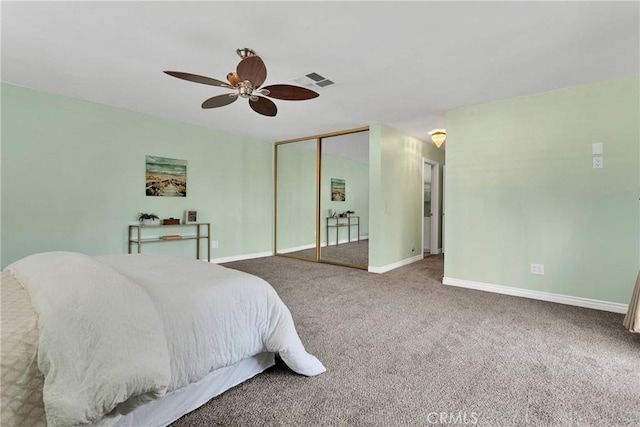 carpeted bedroom featuring a closet and ceiling fan