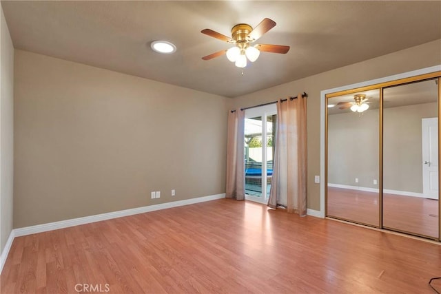 unfurnished bedroom with ceiling fan, light wood-type flooring, access to outside, and a closet