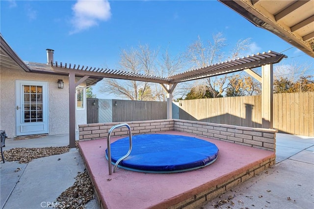 view of patio / terrace with a jacuzzi