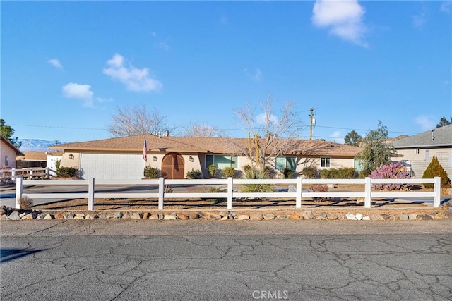 single story home with a garage