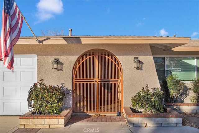 entrance to property featuring a garage