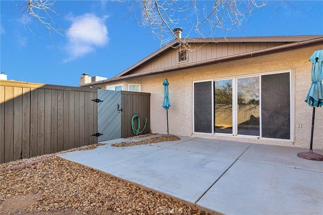 view of property exterior with a patio