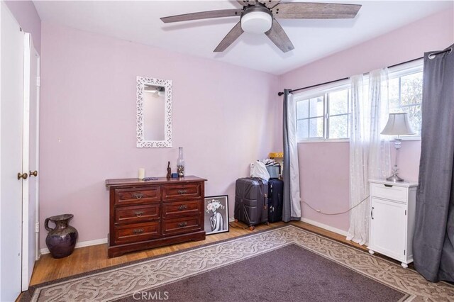 interior space with ceiling fan and light hardwood / wood-style flooring