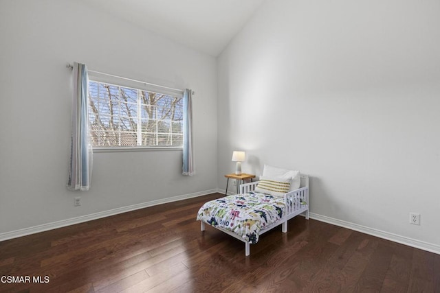 sitting room with vaulted ceiling and dark hardwood / wood-style floors