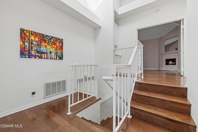 staircase featuring hardwood / wood-style floors