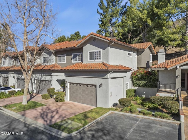 mediterranean / spanish-style house featuring a garage