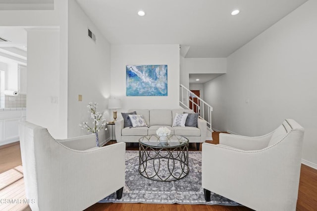 living room featuring dark wood-type flooring