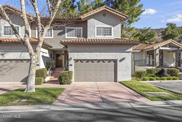 mediterranean / spanish house with a garage