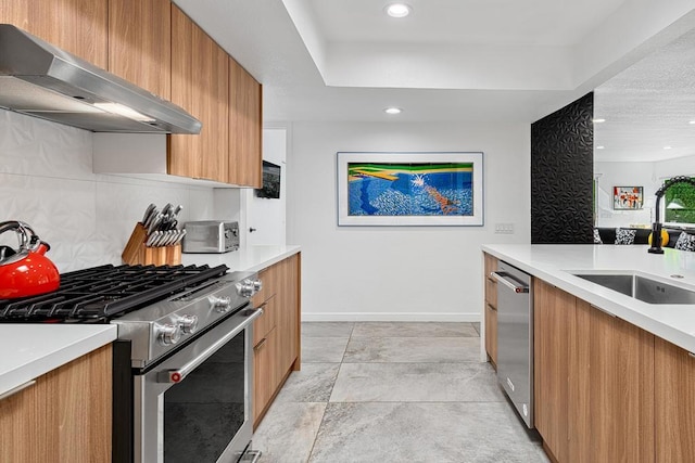 kitchen featuring tasteful backsplash, sink, and appliances with stainless steel finishes