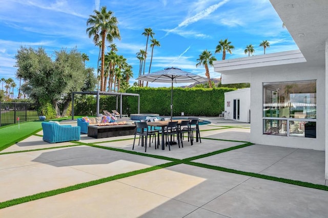 view of patio / terrace featuring an outdoor living space with a fire pit