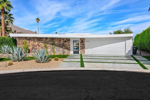 ranch-style home featuring a garage