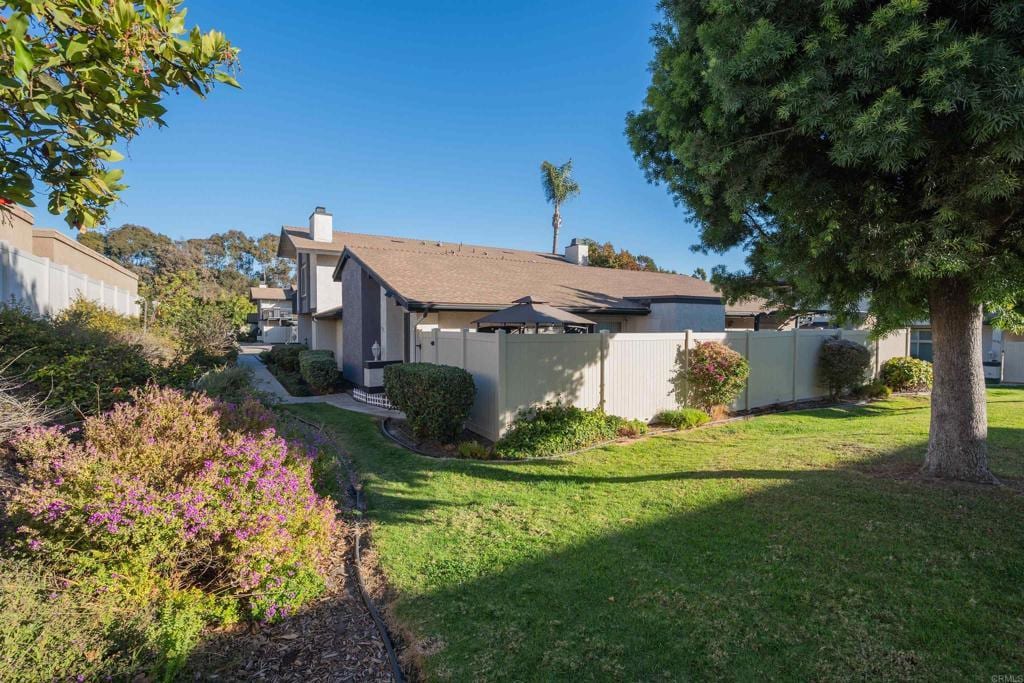 view of property exterior with a lawn